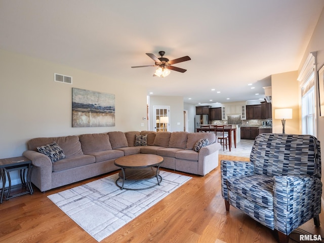 11014 N Saddlehorn Way, Dunlap, IL 61525 - living room featuring light wood-style flooring, a ceiling fan, and recessed lighting