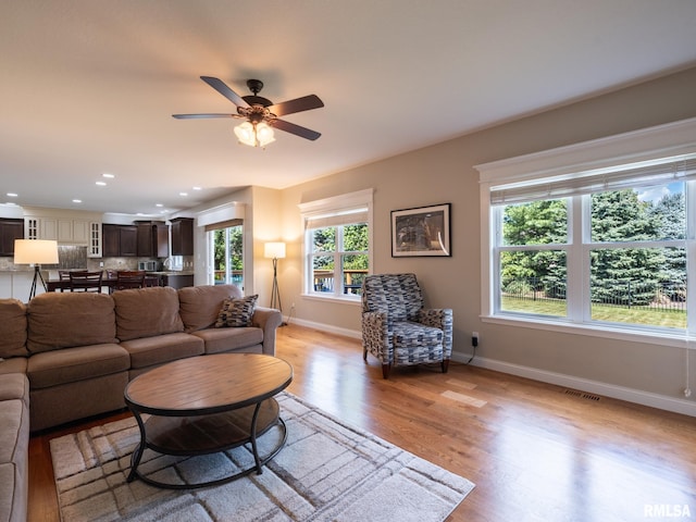 11014 N Saddlehorn Way, Dunlap, IL 61525 - living room with light wood finished floors, a ceiling fan, and recessed lighting
