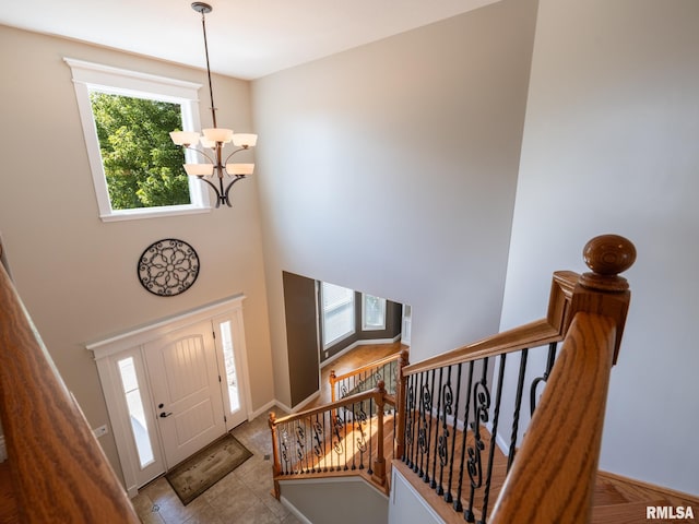 11014 N Saddlehorn Way, Dunlap, IL 61525 - entryway with a chandelier, a high ceiling, and stairway