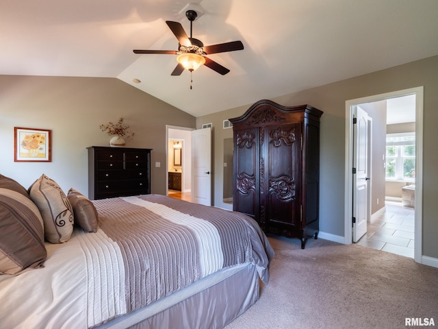 11014 N Saddlehorn Way, Dunlap, IL 61525 - bedroom with vaulted ceiling, ensuite bathroom, light carpet, and a ceiling fan