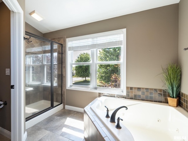11014 N Saddlehorn Way, Dunlap, IL 61525 - full bath featuring a whirlpool tub, a stall shower, tile patterned floors, and lofted ceiling