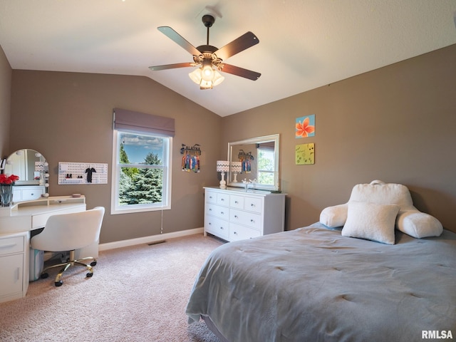 11014 N Saddlehorn Way, Dunlap, IL 61525 - bedroom with vaulted ceiling, light colored carpet, a ceiling fan, and a desk