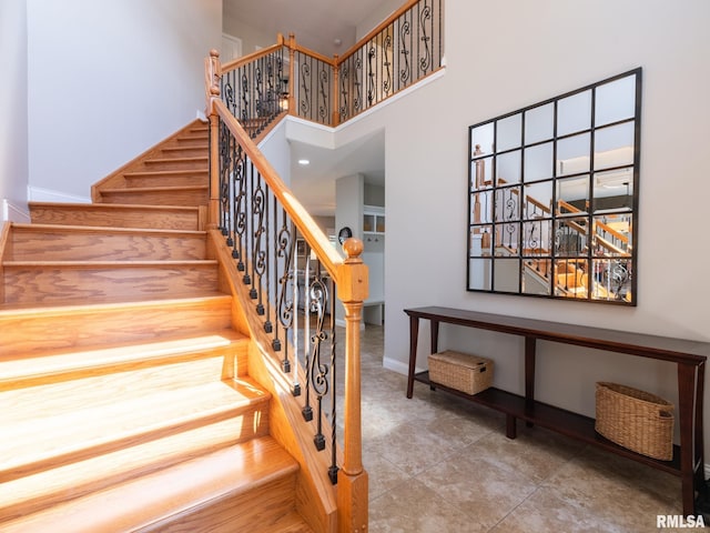 11014 N Saddlehorn Way, Dunlap, IL 61525 - staircase featuring a towering ceiling and tile patterned floors