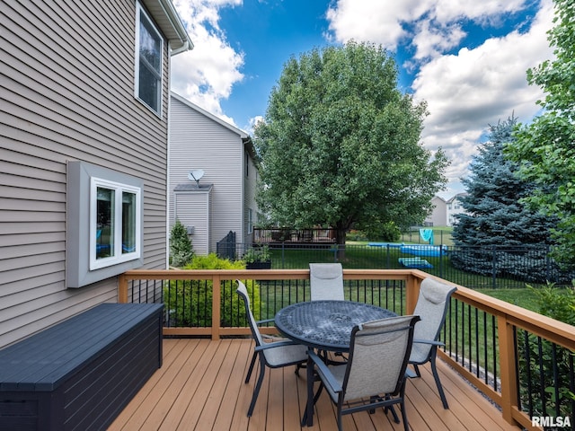 11014 N Saddlehorn Way, Dunlap, IL 61525 - wooden deck with a fenced backyard and outdoor dining space