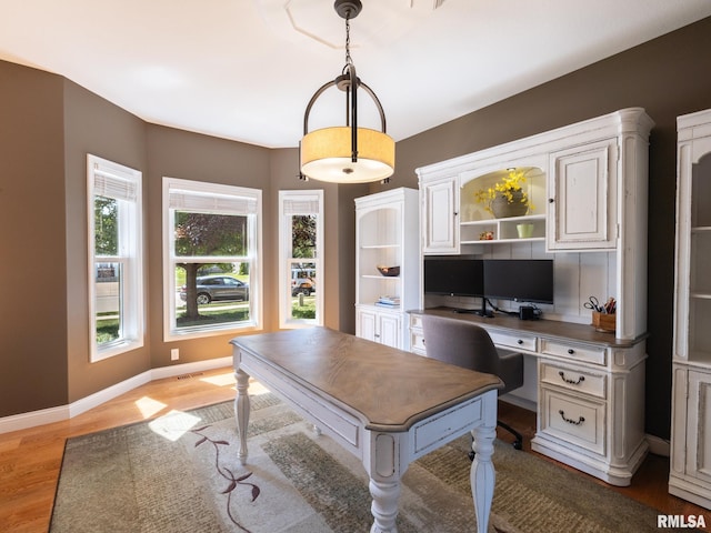 11014 N Saddlehorn Way, Dunlap, IL 61525 - office space with light wood-style floors and built in desk