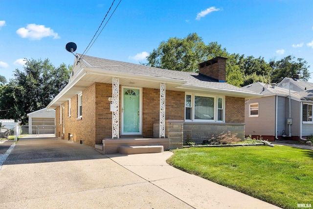 2400 W Callender Ave, West Peoria, IL 61610 - bungalow with brick siding, a chimney, an outdoor structure, and a shingled roof