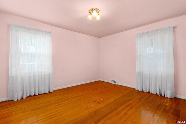 2400 W Callender Ave, West Peoria, IL 61610 - spare room featuring light wood-type flooring and baseboards