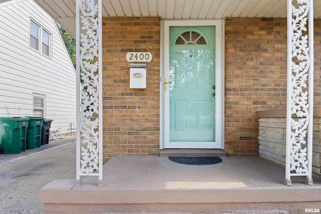 2400 W Callender Ave, West Peoria, IL 61610 - property entrance featuring brick siding and a porch