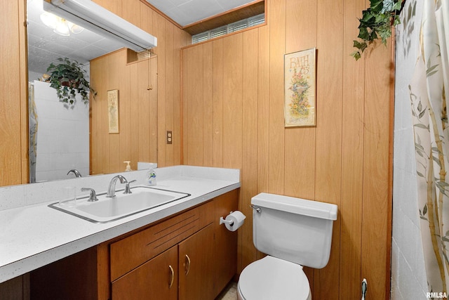 2400 W Callender Ave, West Peoria, IL 61610 - bathroom featuring vanity and wood walls