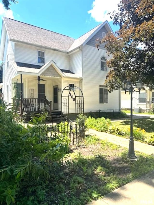 306 W Fremont St, Elmwood, IL 61529 - view of front facade featuring a porch and a shingled roof