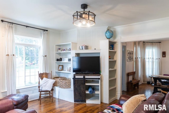 306 W Fremont St, Elmwood, IL 61529 - living room featuring ornamental molding, healthy amount of natural light, and wood finished floors