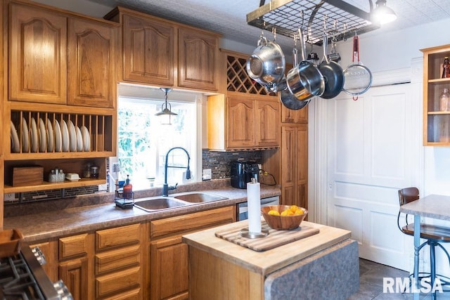 306 W Fremont St, Elmwood, IL 61529 - kitchen featuring open shelves, brown cabinetry, and decorative backsplash