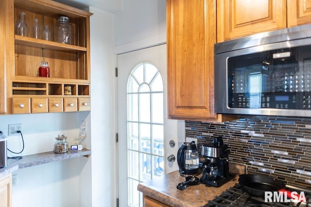306 W Fremont St, Elmwood, IL 61529 - kitchen featuring stainless steel microwave and backsplash