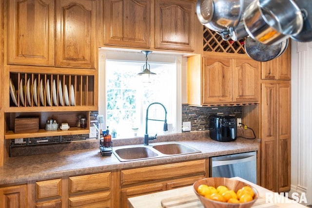 306 W Fremont St, Elmwood, IL 61529 - kitchen with dishwasher, decorative backsplash, and brown cabinets