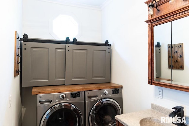 306 W Fremont St, Elmwood, IL 61529 - washroom with cabinet space, washing machine and dryer, and ornamental molding