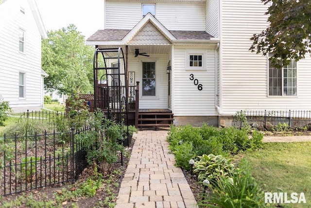 306 W Fremont St, Elmwood, IL 61529 - entrance to property with ceiling fan and roof with shingles