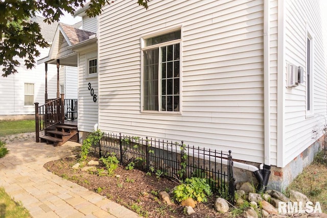 306 W Fremont St, Elmwood, IL 61529 - view of property exterior featuring crawl space