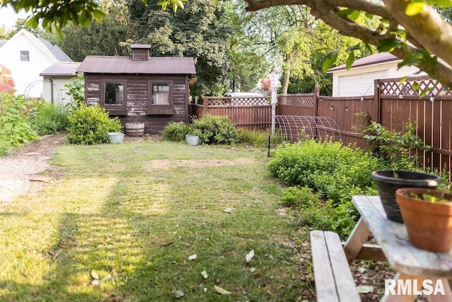 306 W Fremont St, Elmwood, IL 61529 - view of yard with a garage and an outbuilding