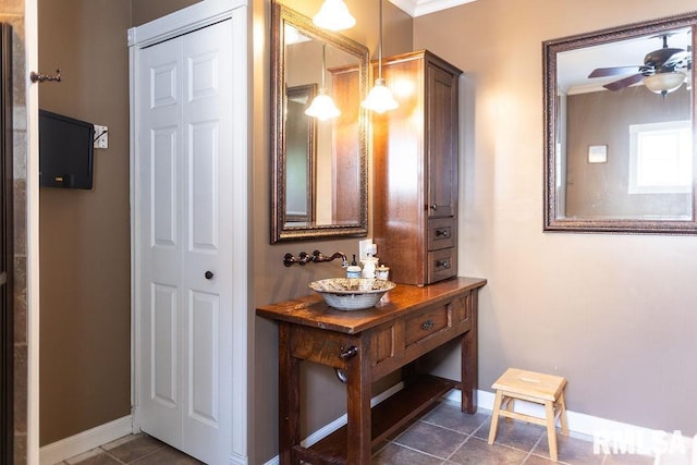 306 W Fremont St, Elmwood, IL 61529 - bathroom with a ceiling fan, tile patterned floors, a closet, and crown molding