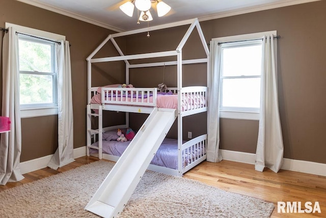 306 W Fremont St, Elmwood, IL 61529 - unfurnished bedroom with crown molding and wood finished floors