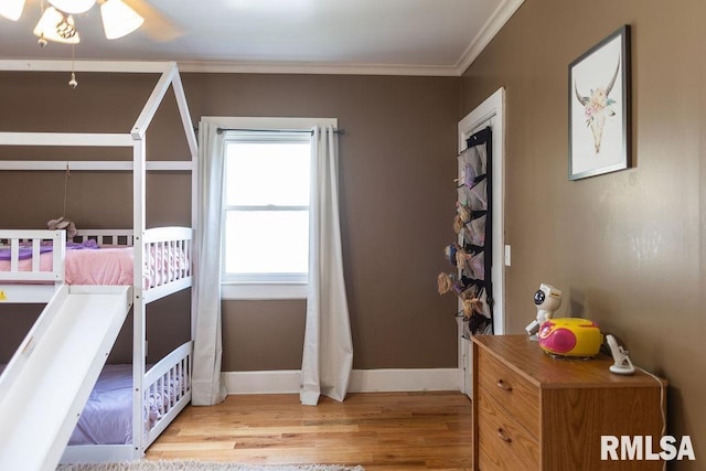306 W Fremont St, Elmwood, IL 61529 - bedroom with light wood-style floors and crown molding