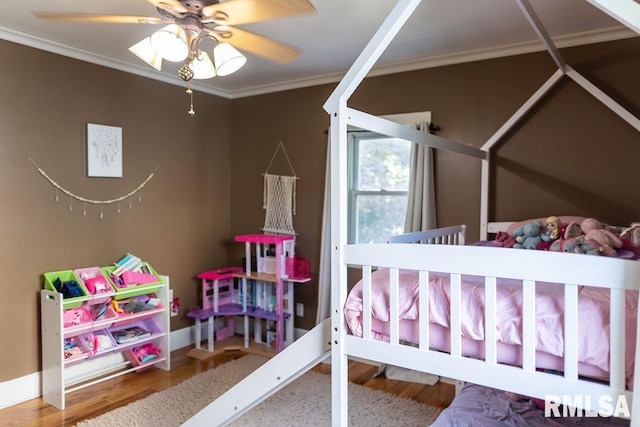 306 W Fremont St, Elmwood, IL 61529 - bedroom with ornamental molding, wood finished floors, and a ceiling fan