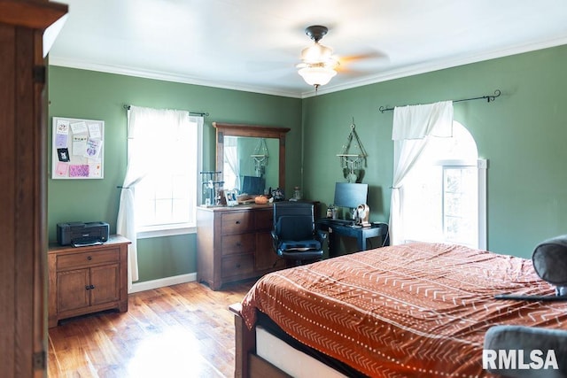 306 W Fremont St, Elmwood, IL 61529 - bedroom featuring light wood-style flooring, crown molding, an office area, and a ceiling fan