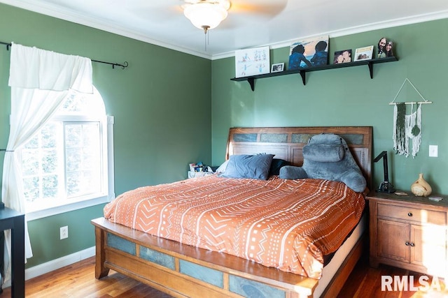 306 W Fremont St, Elmwood, IL 61529 - bedroom with wood finished floors and ornamental molding