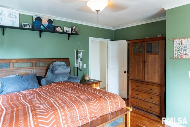 306 W Fremont St, Elmwood, IL 61529 - bedroom featuring wood finished floors, ornamental molding, and a ceiling fan