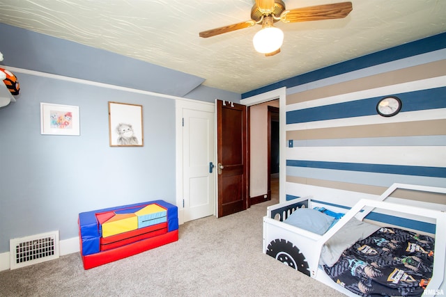 1926 W Callender Ave, West Peoria, IL 61604 - carpeted bedroom featuring a ceiling fan and baseboards