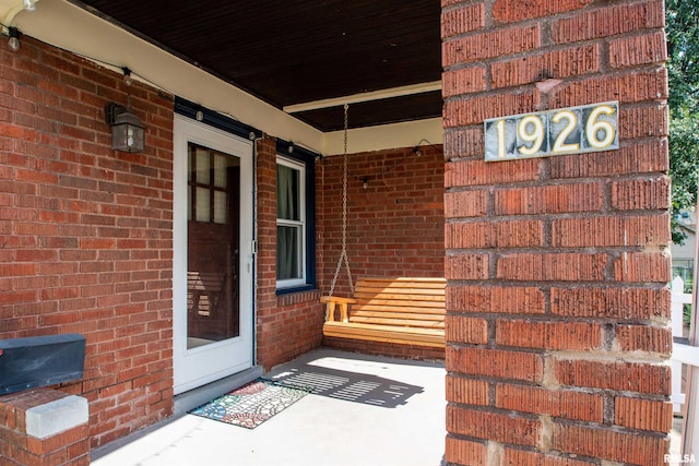 1926 W Callender Ave, West Peoria, IL 61604 - doorway to property featuring brick siding and covered porch