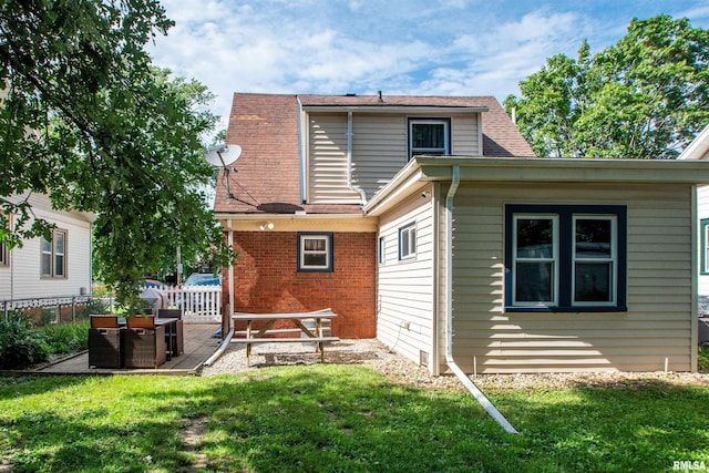 1926 W Callender Ave, West Peoria, IL 61604 - rear view of property featuring brick siding and a wooden deck