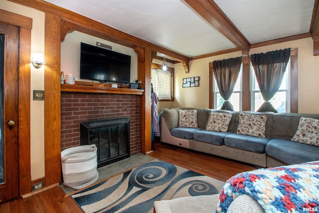 1926 W Callender Ave, West Peoria, IL 61604 - living room featuring wood finished floors, a brick fireplace, and beamed ceiling
