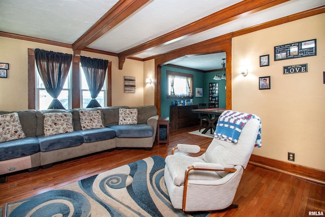 1926 W Callender Ave, West Peoria, IL 61604 - living area featuring wood-type flooring, ornamental molding, beam ceiling, and bar