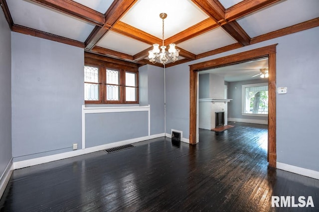 1121 N University St, Peoria, IL 61606 - unfurnished room with a chandelier, dark wood finished floors, coffered ceiling, a fireplace, and beam ceiling