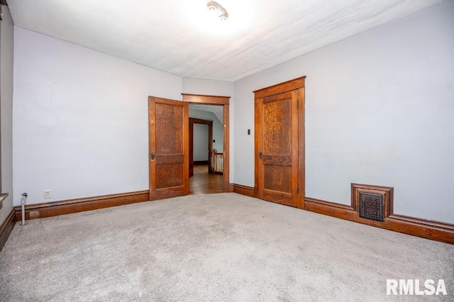 1121 N University St, Peoria, IL 61606 - unfurnished room featuring carpet flooring and baseboards