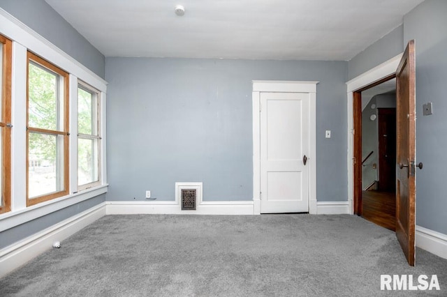 1121 N University St, Peoria, IL 61606 - carpeted spare room with baseboards