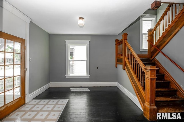 1121 N University St, Peoria, IL 61606 - foyer entrance featuring wood finished floors, healthy amount of natural light, and stairway