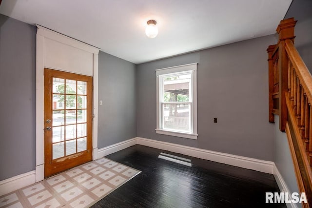 1121 N University St, Peoria, IL 61606 - unfurnished room with plenty of natural light, wood finished floors, and stairway