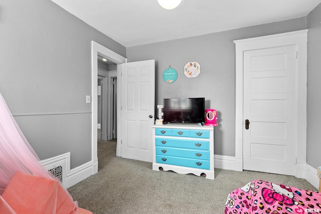 1029 N Santa Fe Ave, Chillicothe, IL 61523 - bedroom with carpet and wainscoting