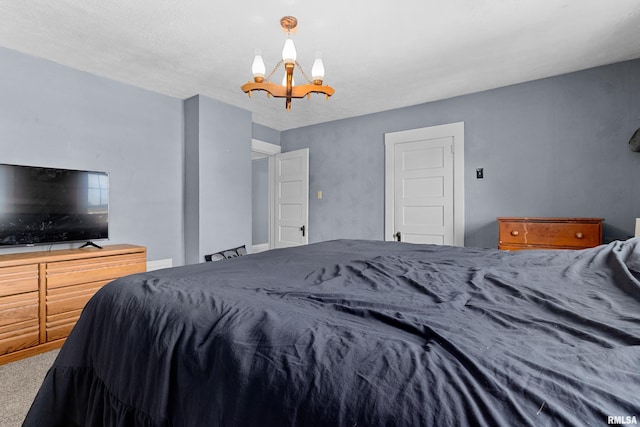 1029 N Santa Fe Ave, Chillicothe, IL 61523 - carpeted bedroom with a chandelier