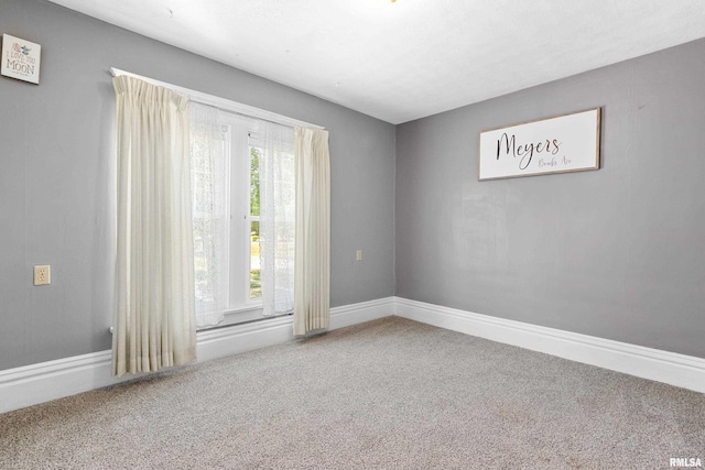 1029 N Santa Fe Ave, Chillicothe, IL 61523 - spare room with carpet flooring and baseboards