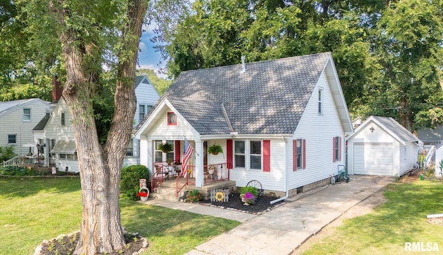 1108 Summer St, Pekin, IL 61554 - view of front of home with a porch, an outdoor structure, driveway, a front yard, and a garage