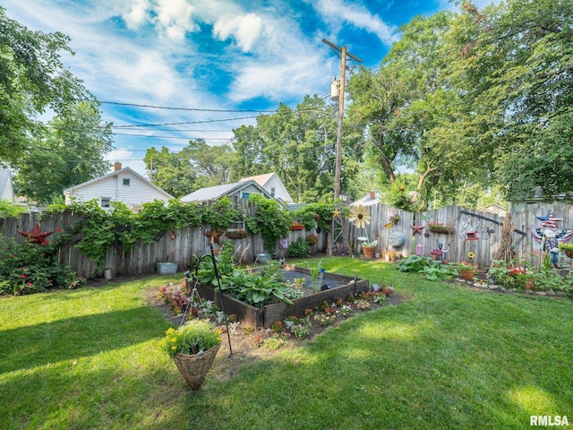 1108 Summer St, Pekin, IL 61554 - fenced backyard with a garden