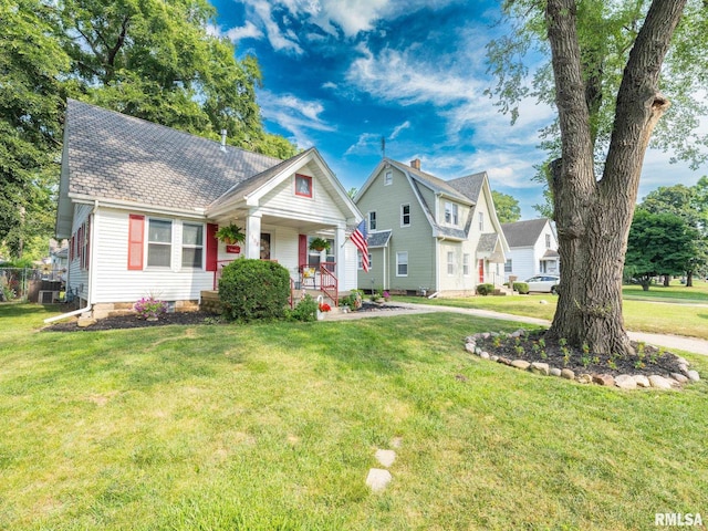 1108 Summer St, Pekin, IL 61554 - view of front of property featuring covered porch and a front lawn