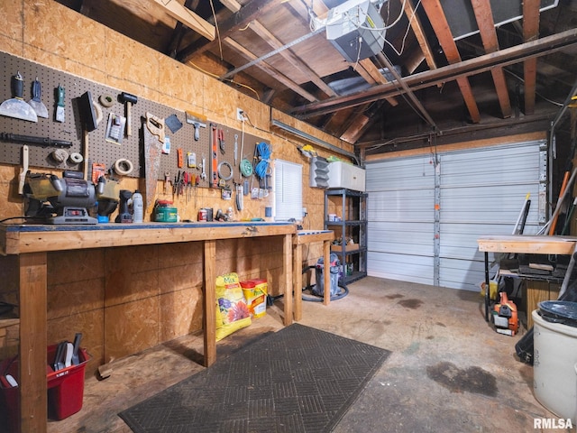1108 Summer St, Pekin, IL 61554 - garage featuring a garage door opener and a workshop area