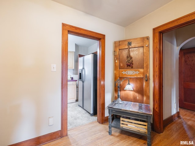1108 Summer St, Pekin, IL 61554 - corridor with arched walkways and light wood-style flooring