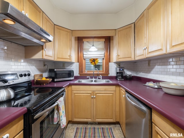 1108 Summer St, Pekin, IL 61554 - kitchen with appliances with stainless steel finishes, extractor fan, dark countertops, and decorative backsplash