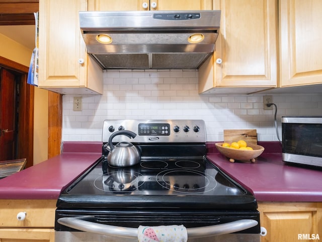 1108 Summer St, Pekin, IL 61554 - kitchen featuring stainless steel electric range oven, under cabinet range hood, backsplash, and light brown cabinetry