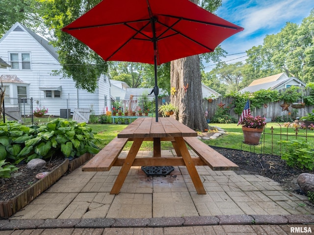 1108 Summer St, Pekin, IL 61554 - fenced backyard featuring outdoor dining space and a patio area
